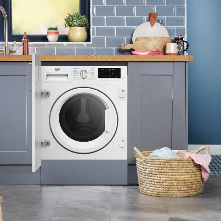 WDIK854411F Perfect for busy households, this integrated washer dryer can wash a full 8kg load in just 28 minutes, helping you get through laundry faster. Sensor Drying Programmes automatically stop the cycle when optimal dryness is reached, protecting your clothes from over-drying. Easy to install, the appliance features front adjustment screws to reposition the rear feet without hassle. For added peace of mind, it’s backed by our 10 Year Beko Parts Guarantee.